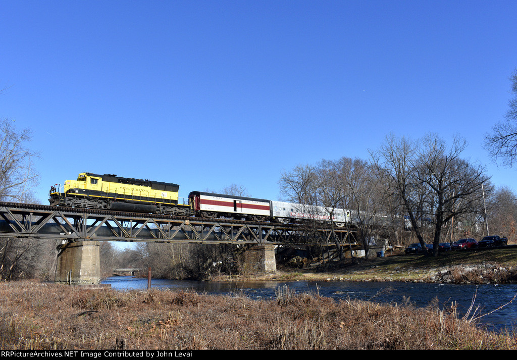 Unit # 3016 leads the train across the bridge with the Erie Lackawanna Baggage Car # 1785 in plain view 